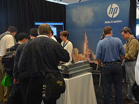 Attendees review gear at the HP booth at the fifth Open Compute Summit in San Jose, CA, last week. The event drew about 3,500 participants, who were eager to see what vendors have produced with OCP designs. (Photo by Colleen Miller.)