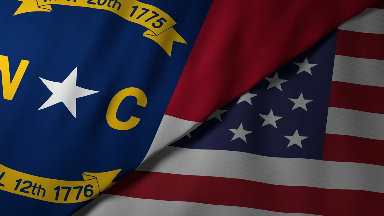 Close-up view of the North Carolina state flag alongside the United States national flag