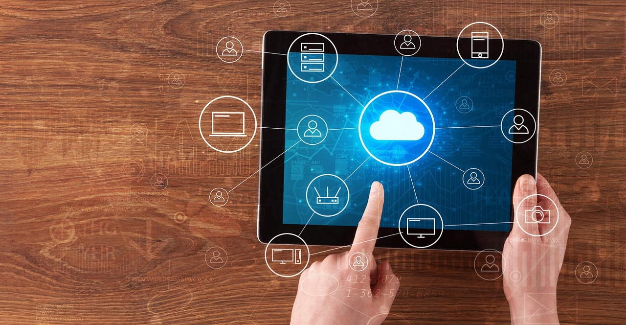 finger pressing "cloud" button on tablet finger pressing "cloud" button on tablet