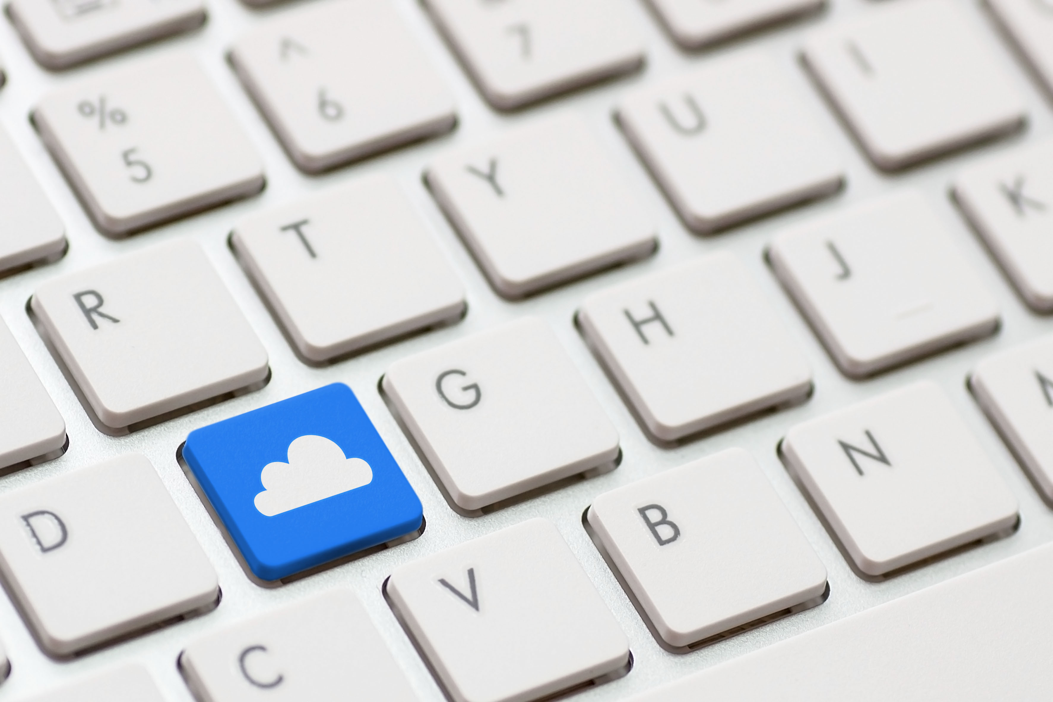 image of a keyboard with a blue key with a cloud on it