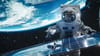 conceptual image of an astronaut outside an orbiting space station conceptual image of an astronaut outside an orbiting space station