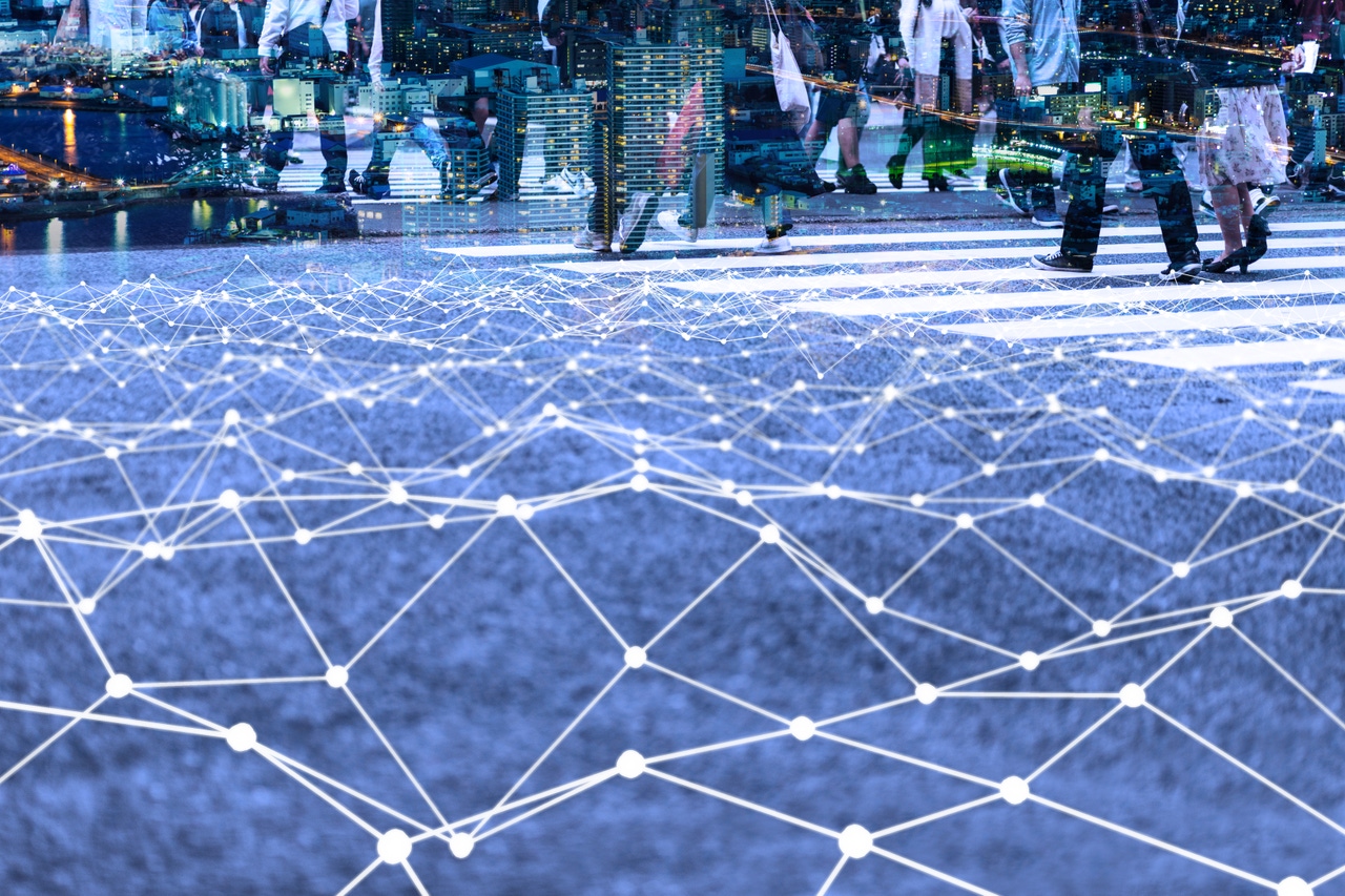 Image shows a walking crowd and mesh communication network concept. Image shows a walking crowd and mesh communication network concept.
