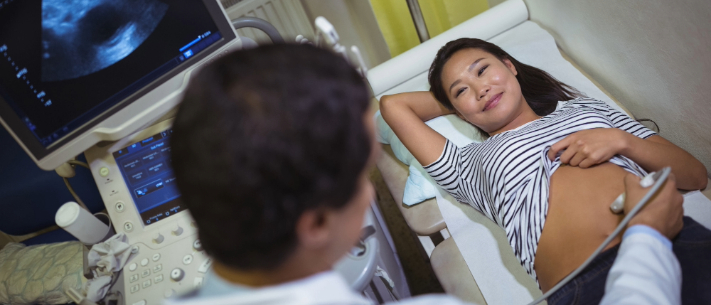 Female patient receiving an ultrasound scan on the stomach