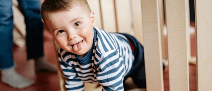 Playful Baby Crawling Tounge Out