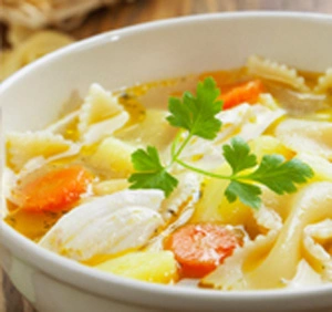Close-up of a bowl of chicken sopas.