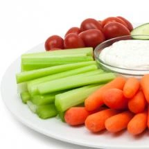 Vegetables on plate with dipping sauce