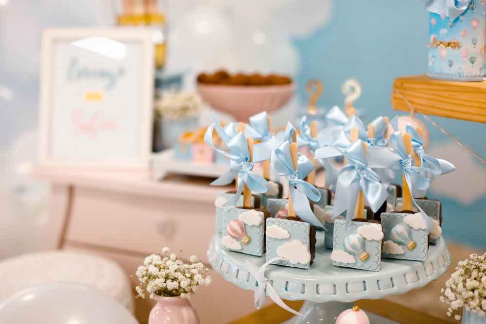 Dessert Table with Cake Pops and Hot Air Balloon Decorations, in Pastel Color Scheme
