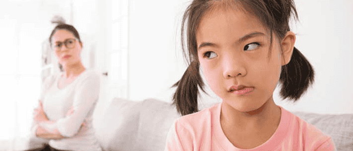Young Girl with Pigtails Having a Tantrum with Her Mom in Bright Interior Space