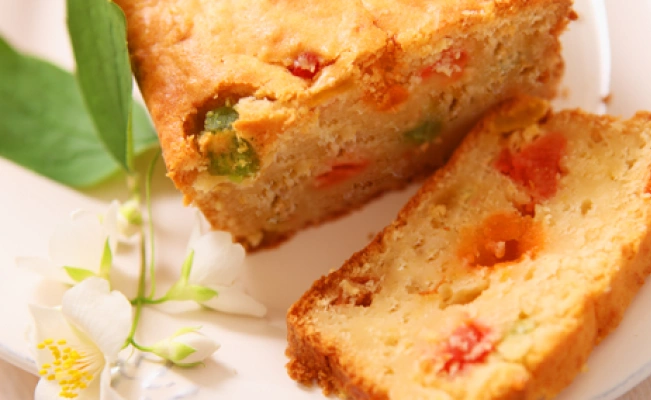 Fruit cake on platter with a flower decor