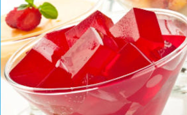 Juice jelly cubes on clear glass