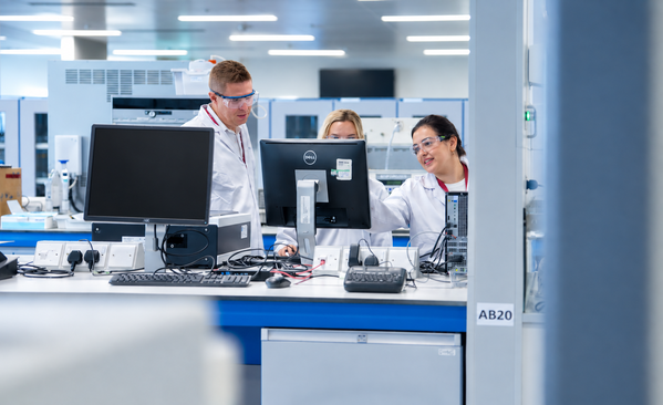 Scientists collaborating on research and product development in a modern laboratory