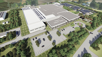 Aerial rendering of a large industrial facility with surrounding parking areas and landscaping