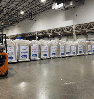 Wrapped pallets of Reckitt Mead Johnson Enfamil products stored inside a warehouse facility