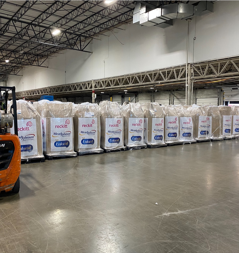 Wrapped pallets of Reckitt Mead Johnson Enfamil products stored inside a warehouse facility