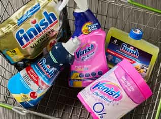 Assortment of Finish and Vanish cleaning products in a shopping basket.