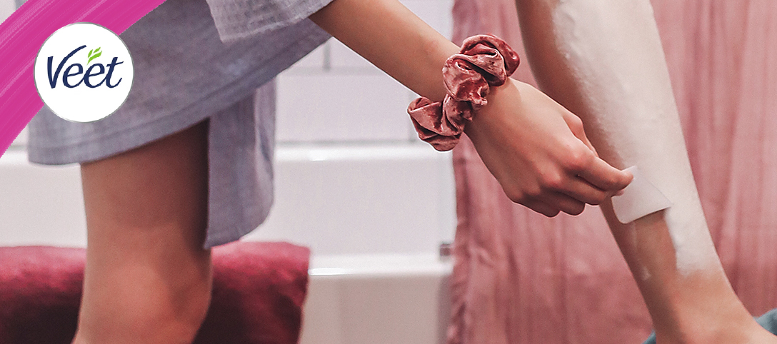 Veet banner featuring a woman applying hair removal cream to her leg