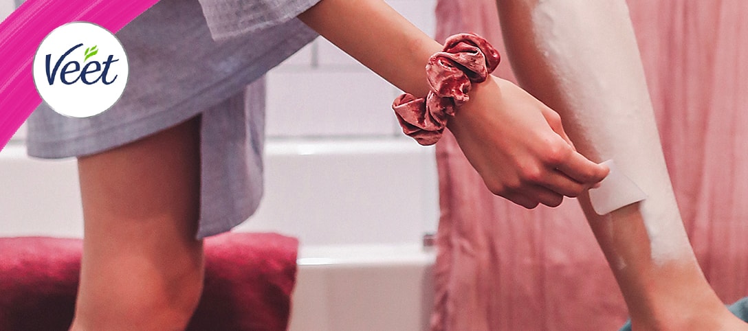 Veet banner featuring a woman applying hair removal cream to her leg