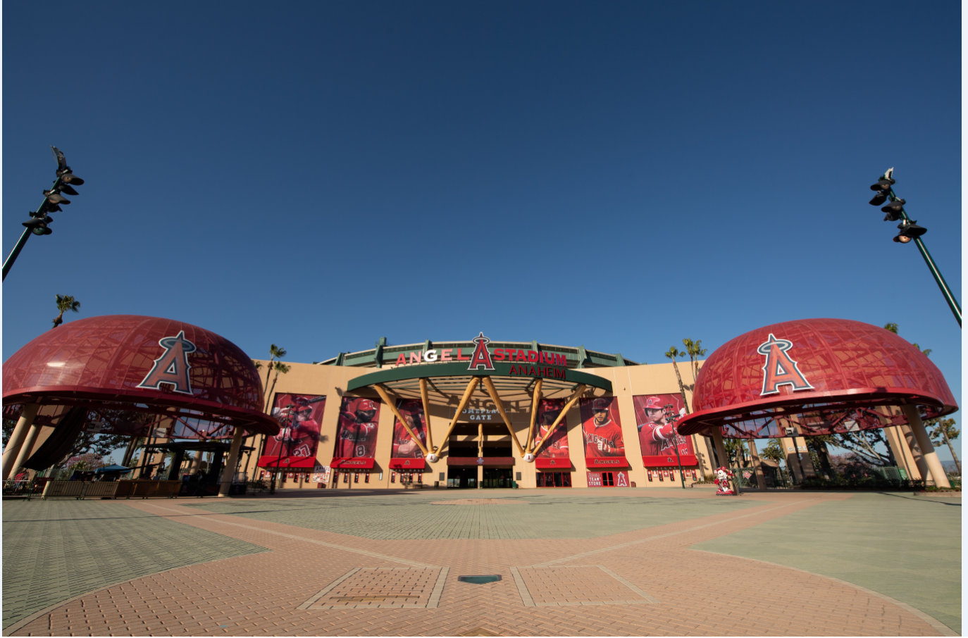 Front entrance of Angel Stadium in Anaheim with Los Angeles Angels branding under a clear blue sky