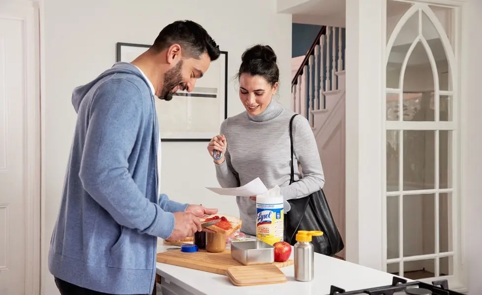 Couple preparing breakfast together in a bright kitchen