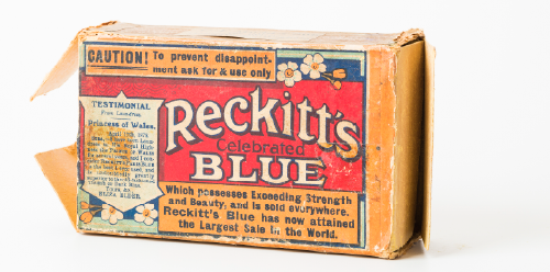 Vintage Reckitt’s Blue box with decorative label and worn packaging.