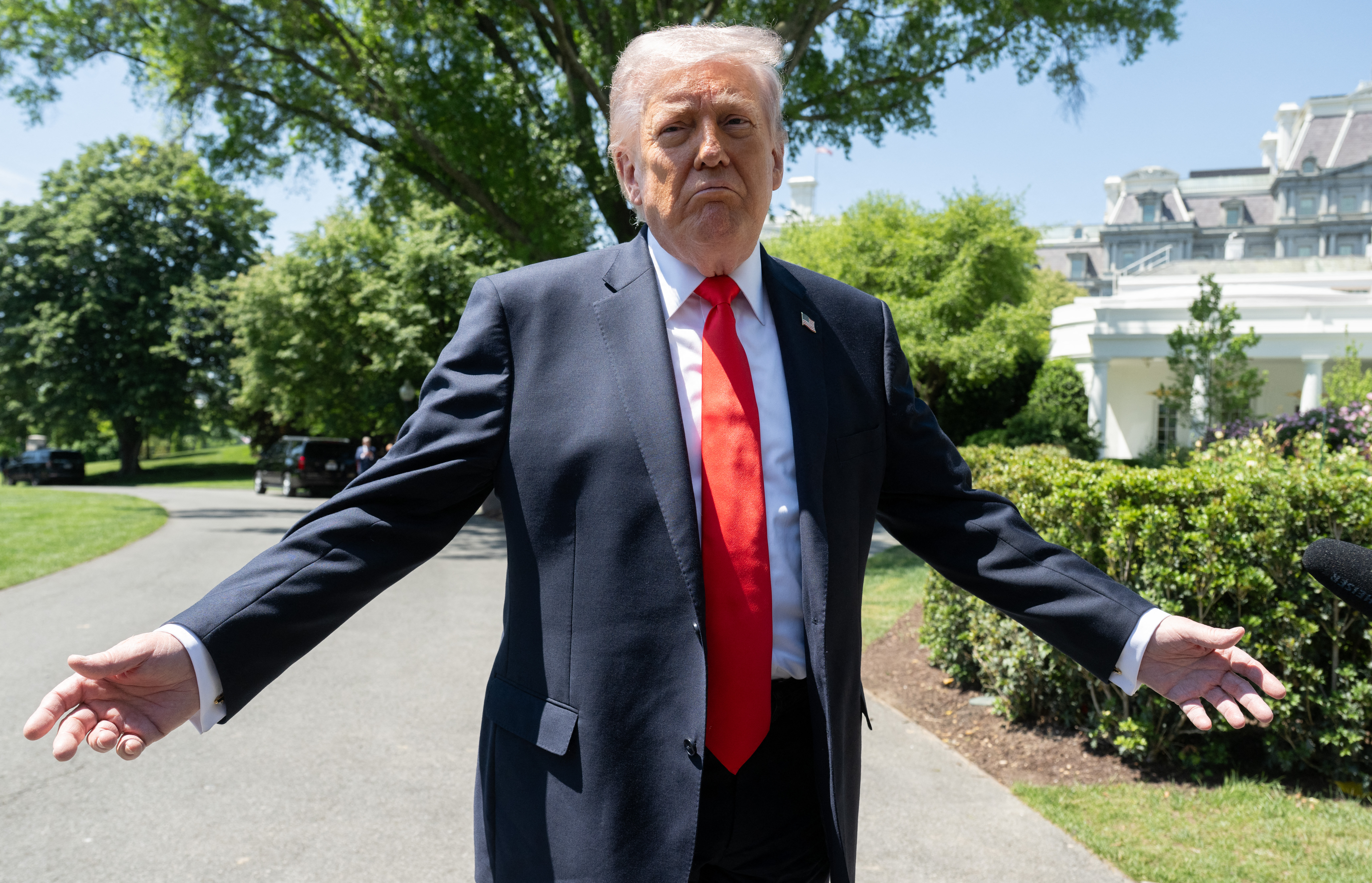 Trump speaks out after erecting 22-foot gold statue of himself at his own  golf course