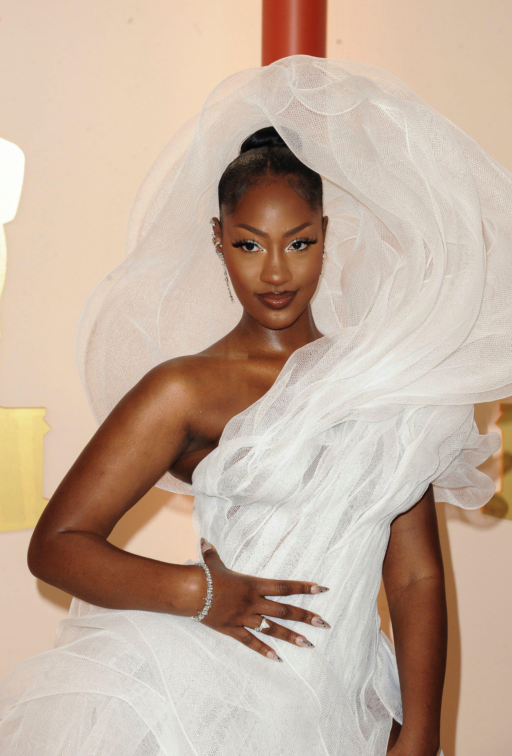 Oscar nominee Tems is criticized for her 'rude' outfit blocking people's  view