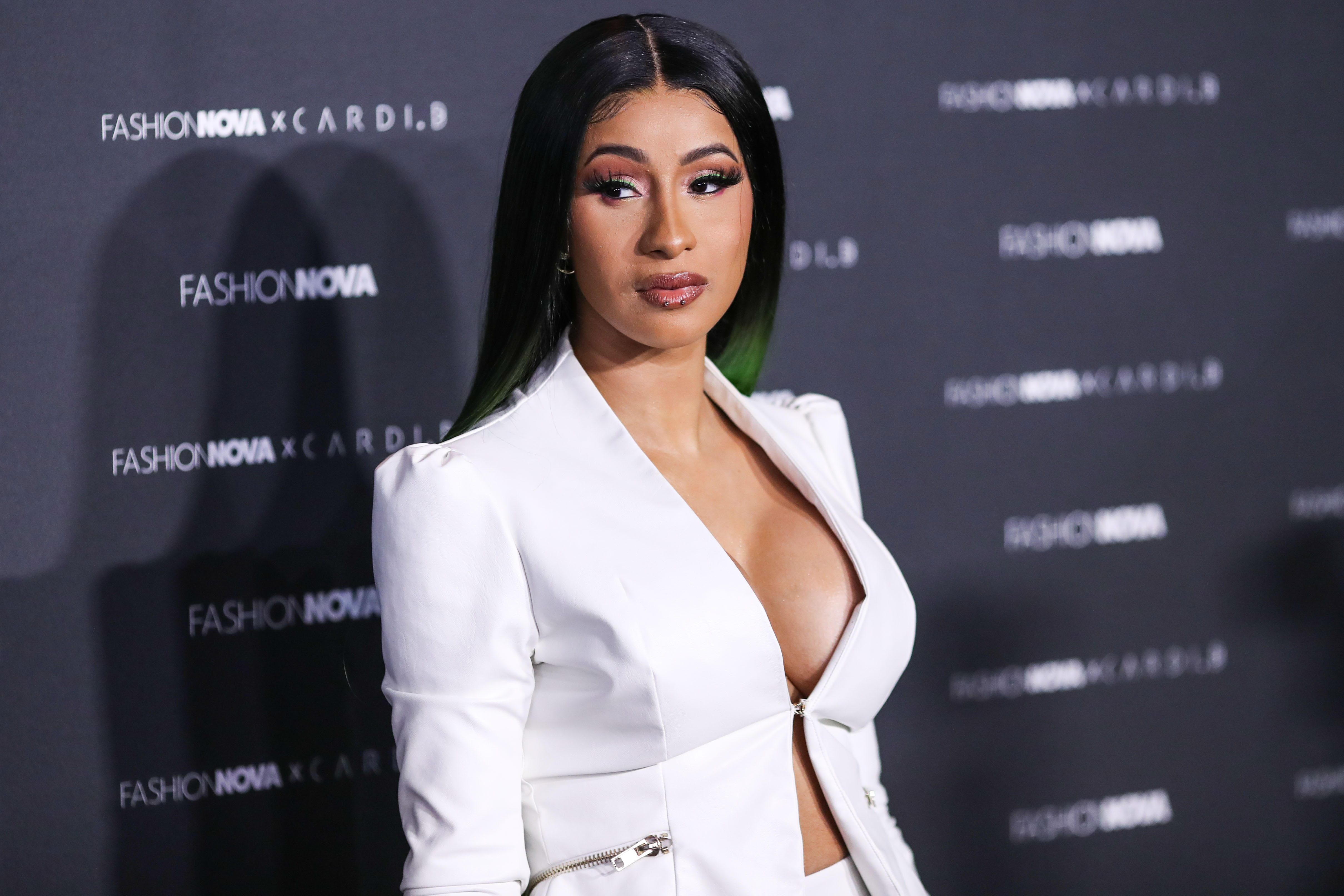 Cardi B wins $350,000 off tattoo artist who sued her claiming shes ruining  his life