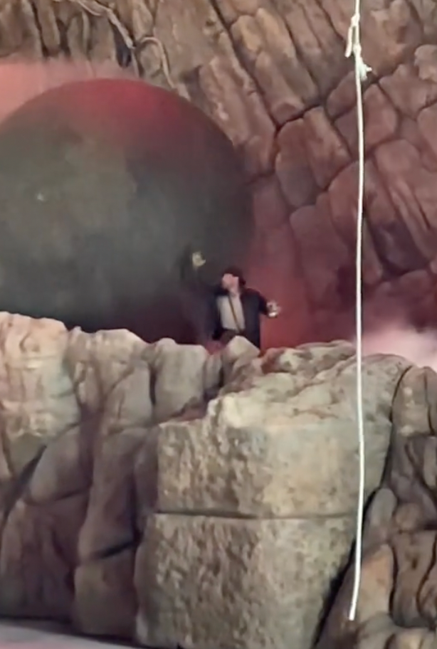 Watch a real-life Indiana Jones get crushed by a giant inflatable boulder