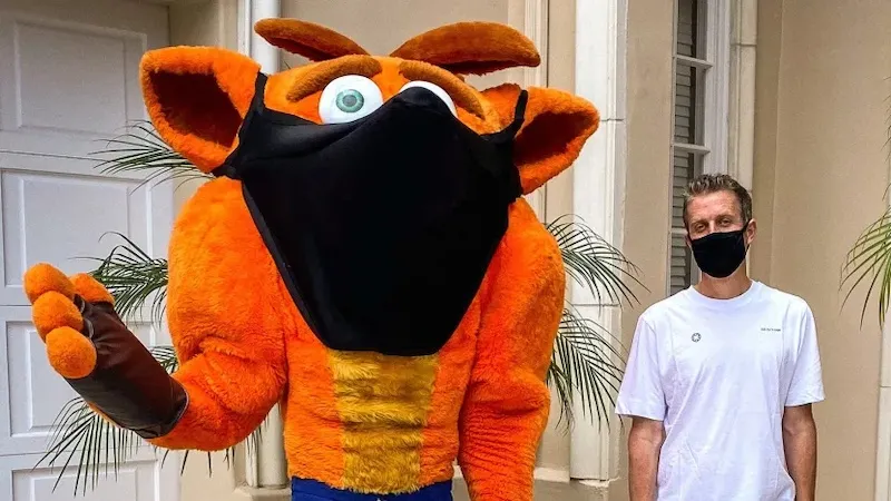 Geoff Keighley and Crash Bandicoot wearing masks