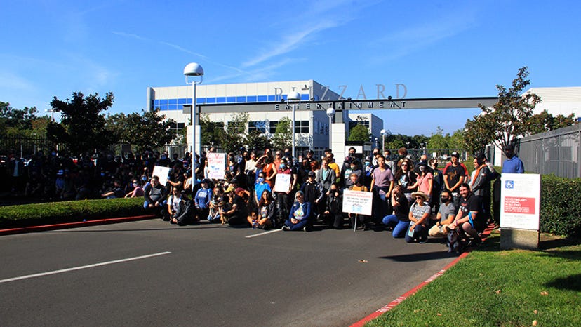 Blizzard employees gather in front of company headquarters.