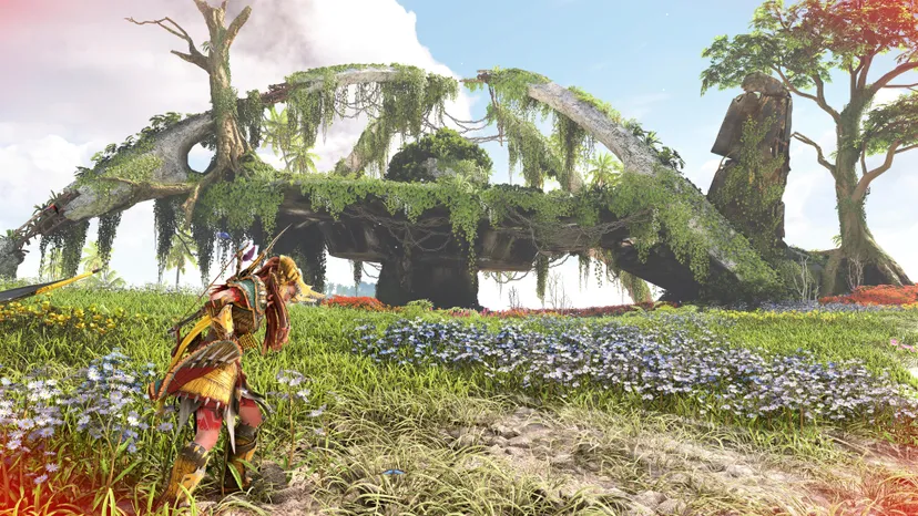 A screenshot of Horizon Forbidden West: Burning Shores. Aloy stands in front of the ruins of LAX.