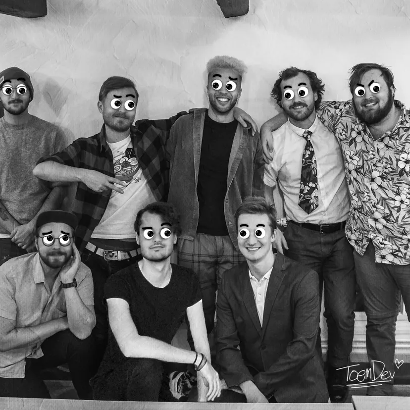 Eight members of the toem dev team pose for an informal black and white photo. Googly eyes and fake eyebrows have been added over their own features.