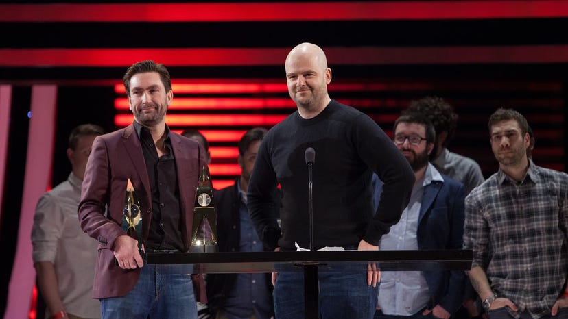 Rockstar Games' Dan Houser (center) at the 2014 DICE Awards with Leslie Benzies (left).