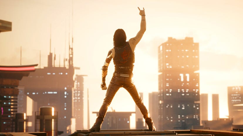 Cyberpunk 2077's Johnny Silverhand throws the horns while looking out over Night City.