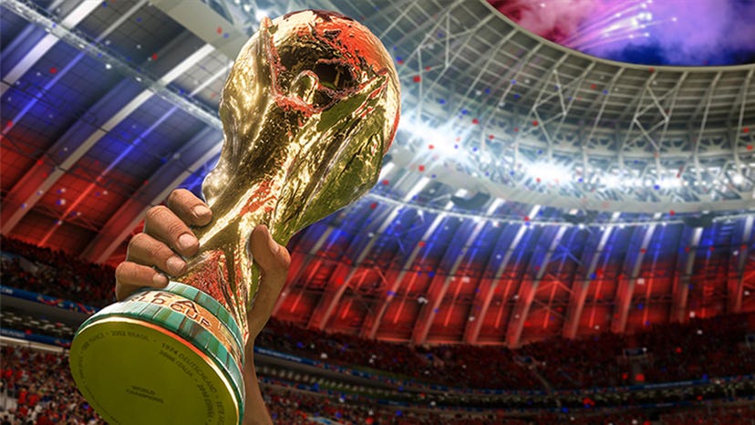 The World Cup held aloft in a stadium adorned with Russian colors