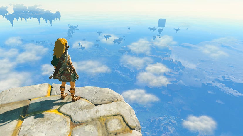 A picture of Link stood atop a floating island looking over Hyrule