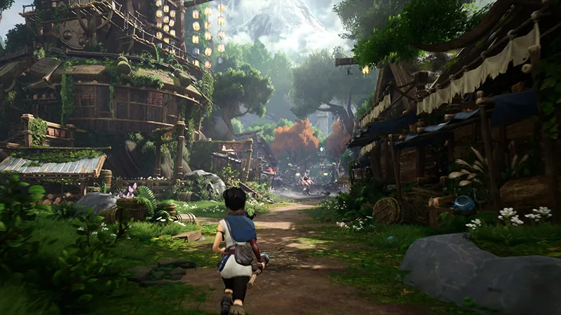A screenshot from Kena: Bridge of Spirits. Thep layer character runs through a town in a lush forest.