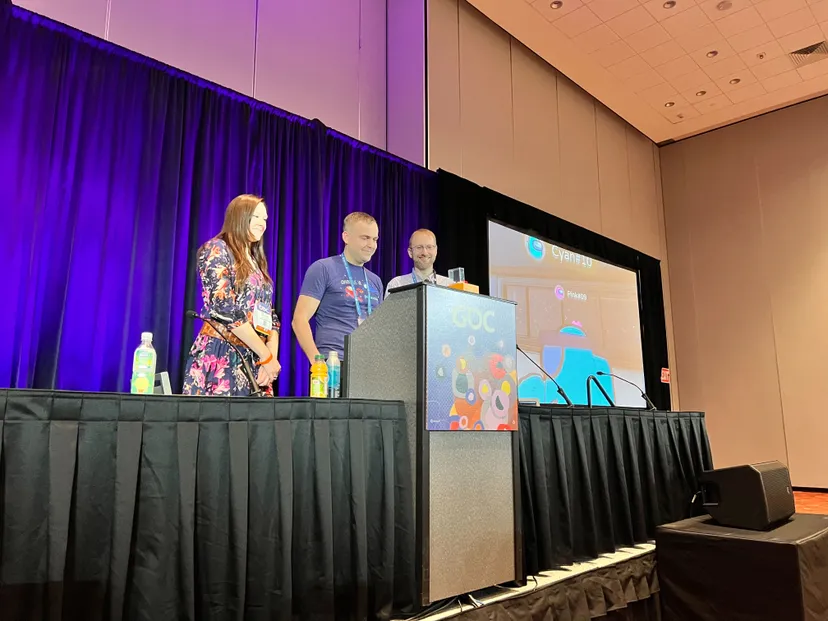 Senior production manager Jennifer Rabbitt, senior game designer Michal Ksiazkiewicz, and principal game designer Shawn Patton watch a viral video featuring Among Us VR