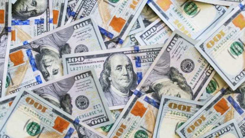 A photograph of many hundred-dollar bills