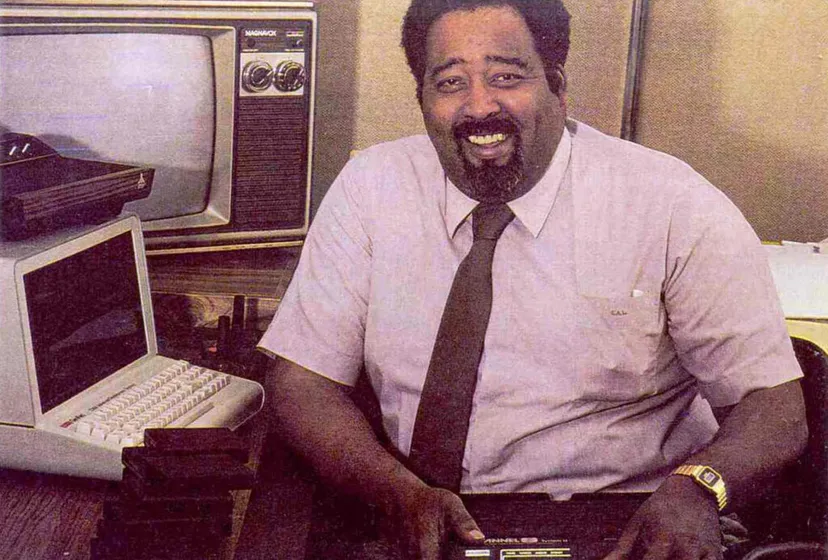 A photograph of Jerry Lawson, in front of his computer.