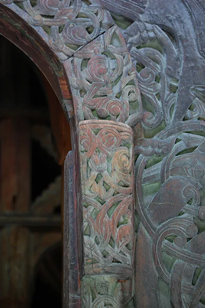 A close up picture of the carved detailing on a Norwegian church.