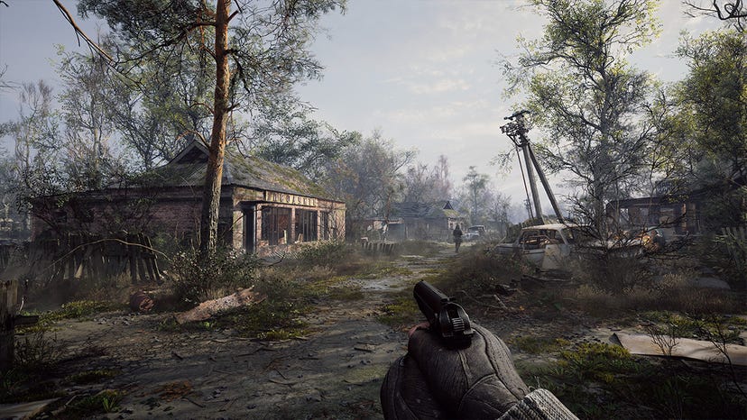 A screenshot from Stalker 2 showing the player exploring an overgrown homestead