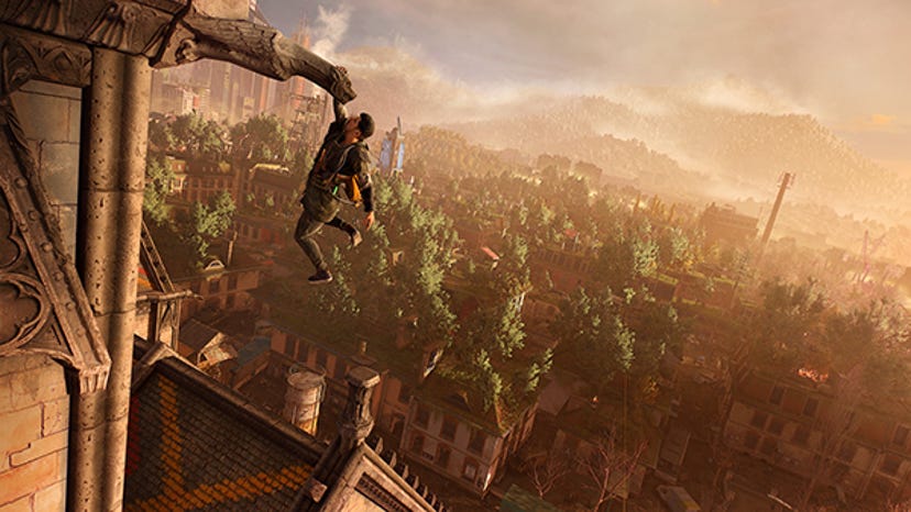 A man dangles from a high perch in Dying Light 2