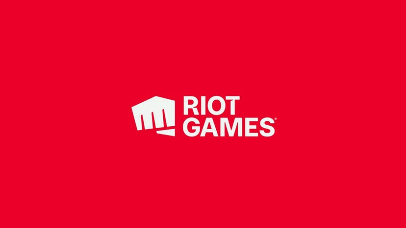 The Riot Games logo on a crimson red background