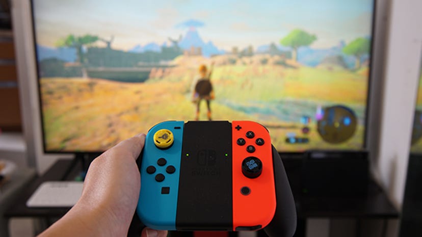 A photo of a Nintendo Switch controller being used to play Breath of the Wild