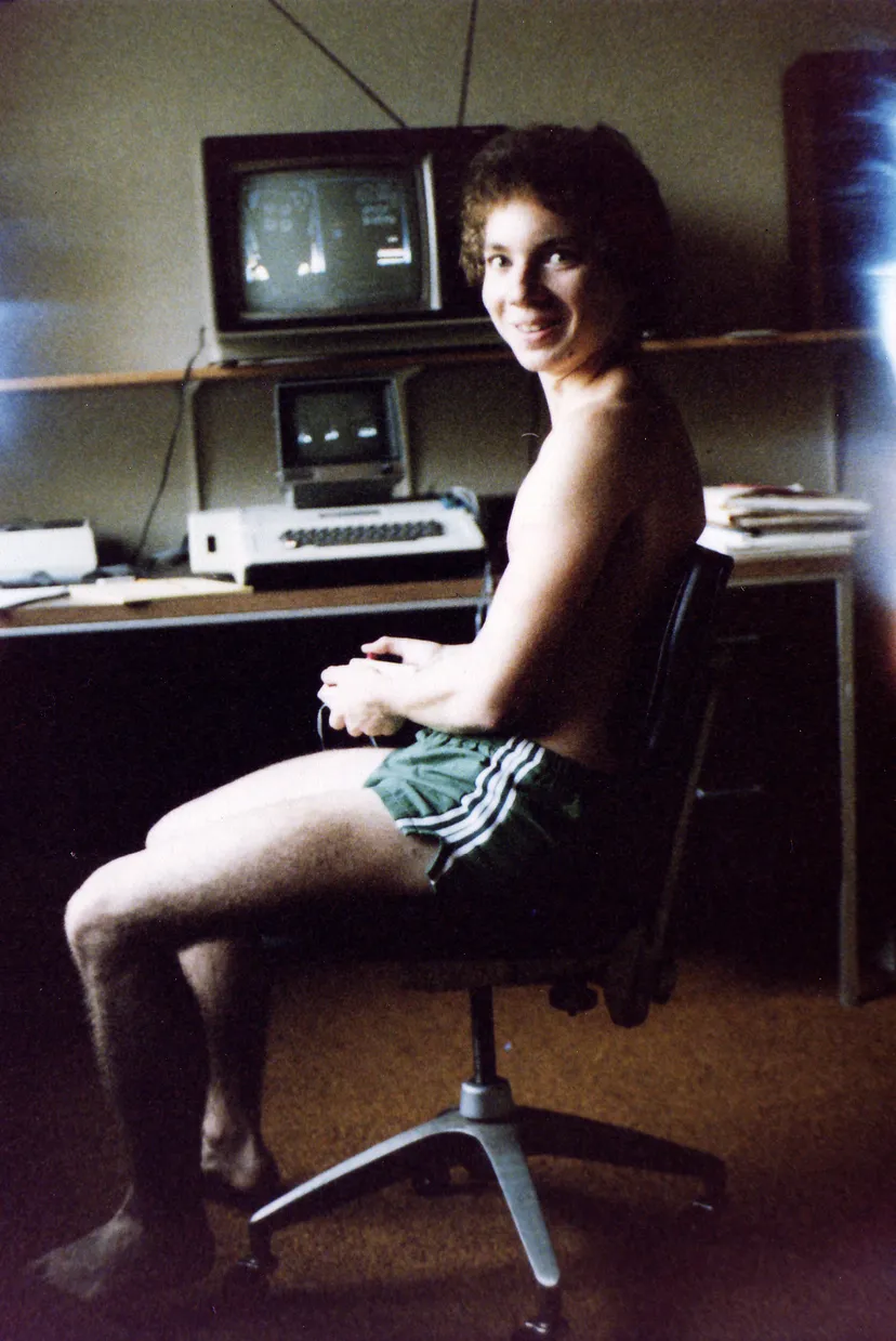 Mechner seated in front of the computer, working on the game
