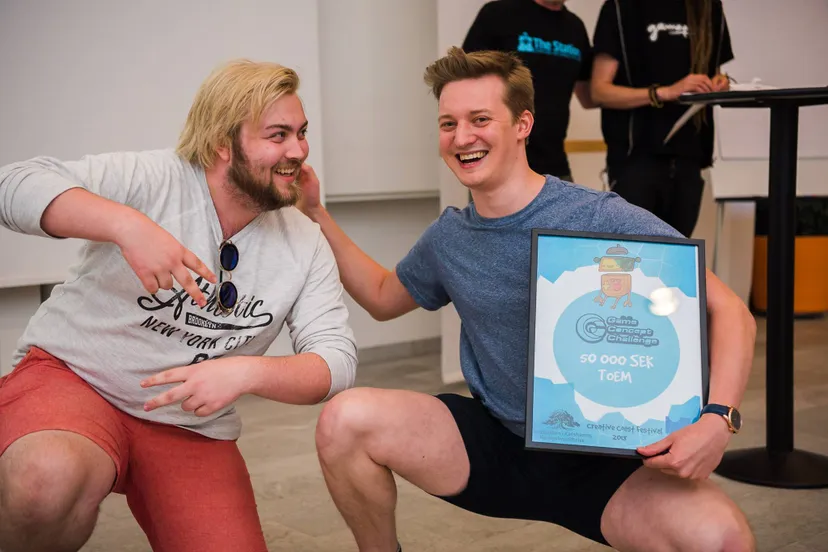 Lucas and Niklas pose with an Game Concept Challenge award