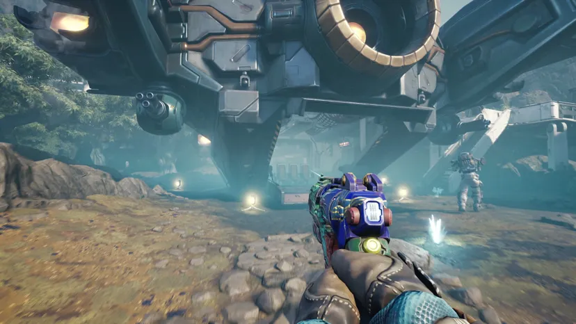 A Cycle player holds a fancy gun.
