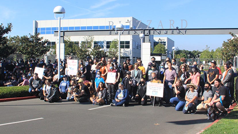Activision Blizzard employees gather outside of the entrance of Blizzard Entertainment.