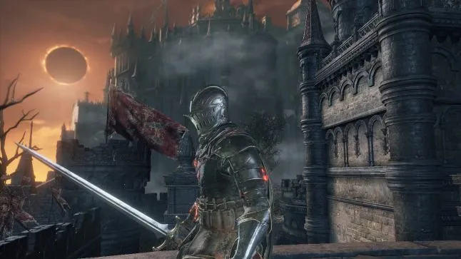 Dark Souls 3; a knight walks in profile against a castle, an eclipsing sun lights the sky orange